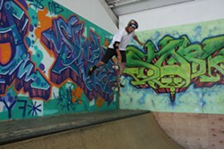 PHOTO BY KEN WEIDERMAN - 16-year-old Kacey Soares foot-plants above the mini ramp at RampArt.