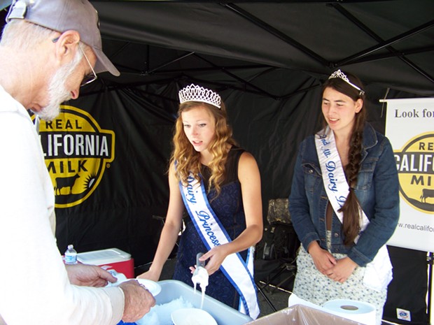 2013 Dairy Princess Andrea Guggenbickler and her second alternate, Paxton Woodward, serving up some ice cream at the Farm Bureau party. - HEIDI WALTERS