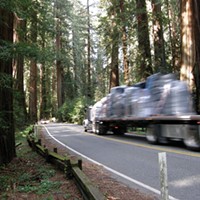 A truck barely stays inside the line while rounding the curve between mile post markers 1.35 and 1.40. The area on the right is where Caltrans proposes a “sliver fill.”