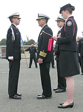 Area Manager Capt. Dan Wenceslao (retired), center, inspects cadets. Photo by Ryan Burns.