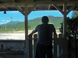 PHOTO BY SCOTTIE LEE MEYERS - Arthur Jones stands on the front porch of his home, where law enforcement found methamphetamine and cash after he was arrested in late 2011.