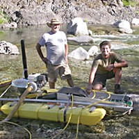 Bill Stanford (left) and his son Chad show off their suction dredge. Photo by Heidi Walters