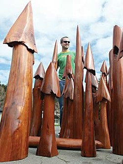 Dan the Faller Man with his carvings that represent a diverse, intact, old-growth forest.