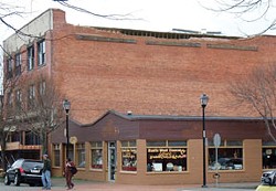 East wall of The Old Town Bar and Grill building, showing the missing parapet. Author Photo