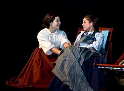 Essie Bertain as Jo and Jessica Malone as Beth in the Humboldt Light Opera production of Little Women (The Musical) at the College of the Redwoods.