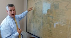 PHOTO BY RYAN BURNS - Eureka attorney Bill Barnum talks about his 1938 map of Eureka created by J.N. Lentell.