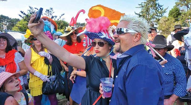 Food Network superstar Guy Fieri poses for a selfie with Kate Walstead Hutchings, one of his duties as guest emcee of Ladies Hat Day, Saturday afternoon, Aug. 23, at the Humboldt County Fair in Ferndale. - PHOTO BY BOB DORAN
