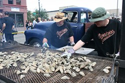 PHOTO BY BOB DORAN - Grilling for the hungry hordes at the Oyster Festival.