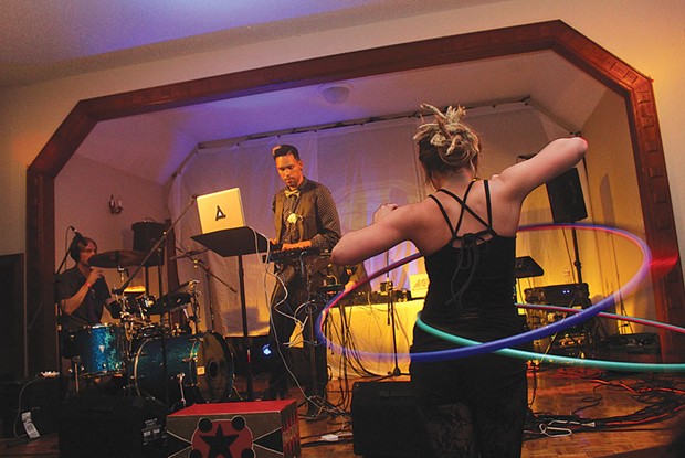 Haley Jo&nbsp;dances with a hoop as&nbsp;Lafa Taylor and his group mix hip hop and bass music, taking KMUD's circus party into the wee, wee hours of Sunday, April 6&nbsp;at Arcata's&nbsp;Portuguese Hall. - PHOTOS BY BOB DORAN
