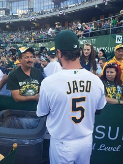 PHOTO COURTESY OF THE OAKLAND ATHLETICS - Jaso signs autographs in Oakland on July 5.