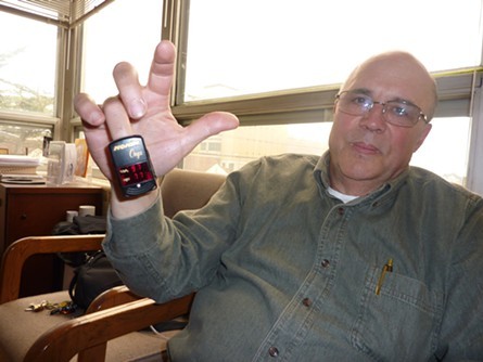Lance Madsen in 2011, showing reporter the oximeter that measures his pulse and blood oxygen. - PHOTO BY RYAN BURNS