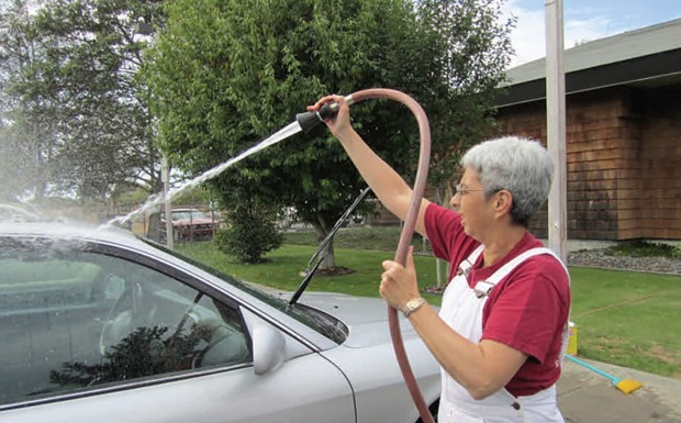 Nancy Dean, meteorologist in charge of the Weather Forecast Office in Eureka, washing cars as part of a fundraiser in 2011. - PHOTO COURTESY OF THE NATIONAL WEATHER SERVICE