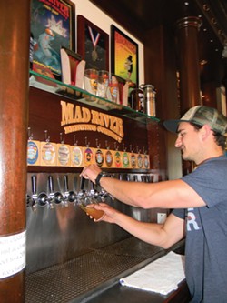 PHOTO BY CARRIE PEYTON DAHLBERG - Nathan Sailor, lead bartender at Mad River Brewery, poured plenty of pints of River Day Session IPA on April 29, the first day of its release.