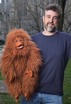 Neuroscientist (and ventriloquist) Michael Graziano with Kevin, who helps him make the point that it's hard not to attribute some degree of consciousness to a "talking" stuffed orangutang. Photo by Robert Adam Mayer