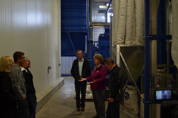 Congressman Jarad Huffman and brewery owner Barbara Groom talk in the sweet and earthy smelling grain room. - GRANT SCOTT-GOFORTH