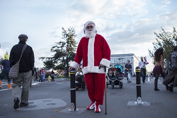 Santa Clause makes a rare pre-season appearance on the Plaza Friday evening. - ALEXANDER WOODARD