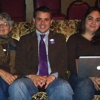 Newly elected city council member Shane Brinton cozies up next to his Mom, Susan Brinton (left), and Kaitlin Sopoci-Belknap to watch election results trickle in.