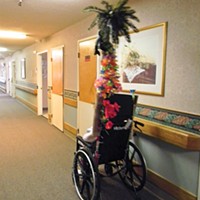 Nurses and aides have decorated the poles attached to some wheelchairs at Seaview Rehabilitation & Wellness Center. The poles are utilitarian – they cannot get past shower rods put over the doors of people who don’t want confused neighbors wandering into