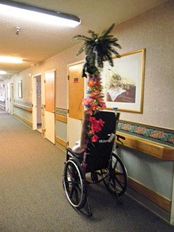 PHOTO BY CARRIE PEYTON DAHLBERG - Nurses and aides have decorated the poles attached to some wheelchairs at Seaview Rehabilitation & Wellness Center. The poles are utilitarian – they cannot get past shower rods put over the doors of people who don’t want confused neighbors wandering into