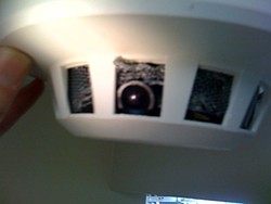 One of the spy cameras disguised to look like a smoke detector.