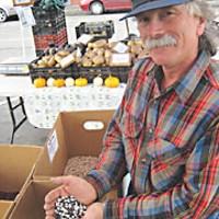 Paul Giuntoli brags on his beans at Arcata's Farmers' Market. Photo by Bob Doran.