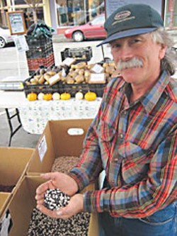Paul Giuntoli brags on his beans at Arcata's Farmers' Market. Photo by Bob Doran.