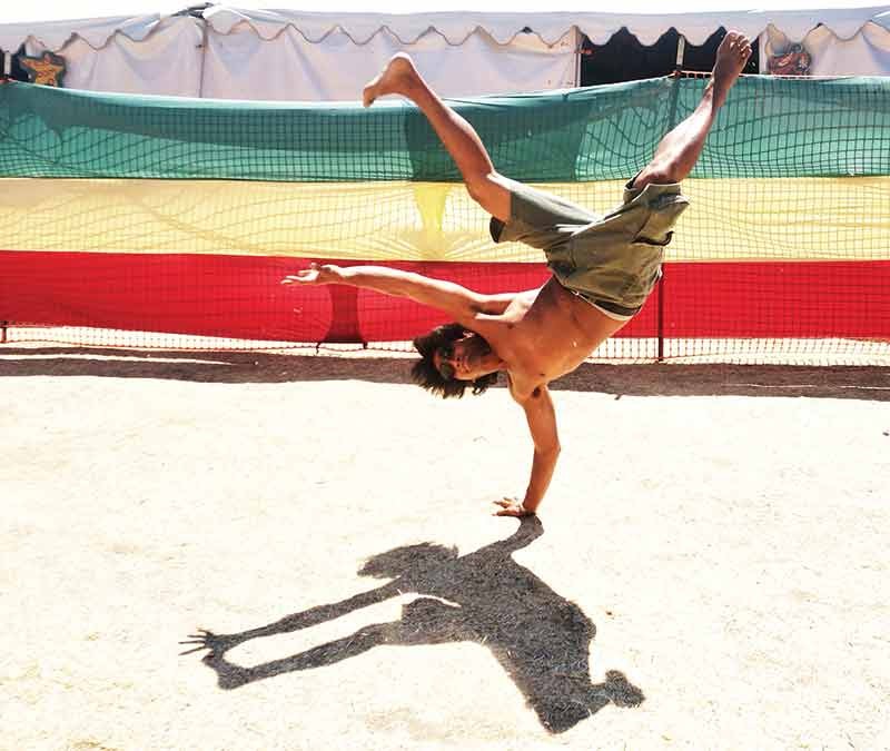 Reckless Rex Atlenza, leader of the break dance crew Humboldt Rockers, breaks a move backstage at Reggae on the River Sunday afternoon, Aug. 3. - PHOTO BY BOB DORAN
