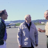 Rep. Huffman (left), news legend Dan Rather and Humboldt County Sheriff Mike Downey chat on the tarmac.