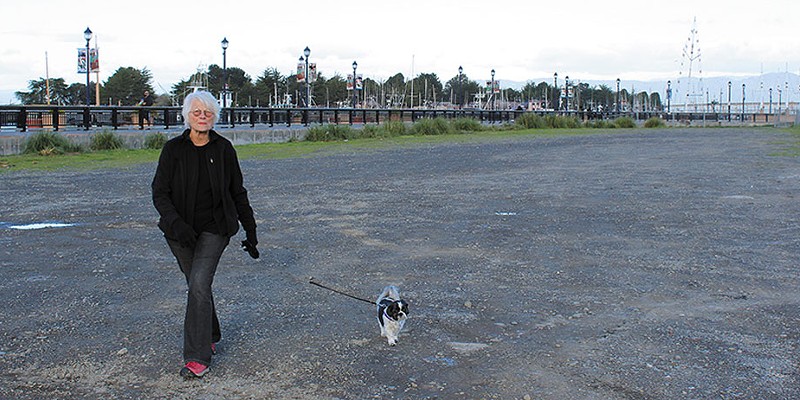 Conflicting Reports Sandra Lingle, a 32-year Eureka resident, has taken to walking her dog, Lou, only during daylight hours because she feels crime has gotten out of hand in the city. Photo by Thadeus Greenson
