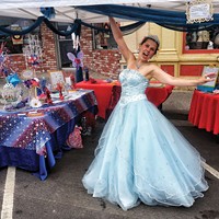 Shoshanna of Redwood Raks CASTS free pixie dust spells in her booth at the Arcata Chamber of Commerce's Fourth of July Jubilee celebration on the plaza.