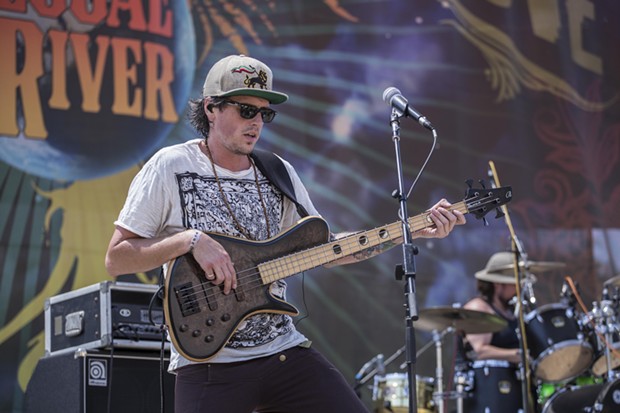 Spencer "Skip Wicked" Burton performing with his band Indubious at the 30th Annual Reggae On The River 2014, Saturday Aug. 2.