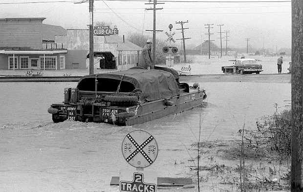 The Army Reserve used DUKWs, or “Ducks,” to rescue people stranded on rooftops and boat them to safety. - PHOTO COURTESY OF GREG RUMNEY