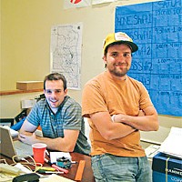 Topher Simon, deputy field organizer (standing) and Eric Lowe, out-of-state volunteer. Photo by Judy Hodgson.