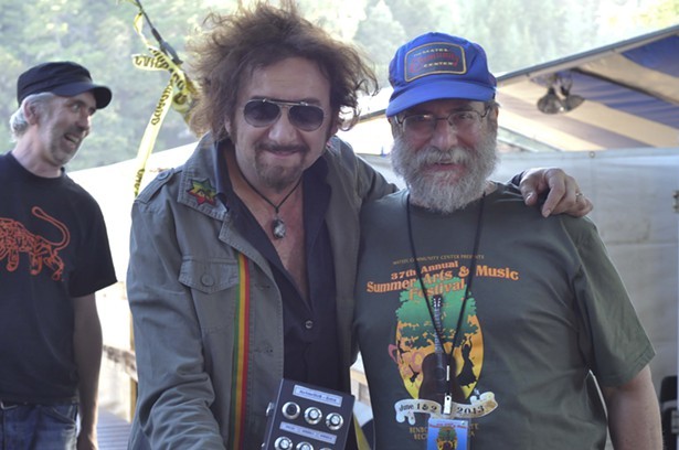 Tree stage MC Jimmy Durchlag hangs out backstage with producer/performer Gaudi, who had traveled from France for this year's Summer Arts and Music Festival in Benbow. - ©TRAVIS TURNER