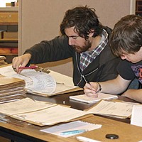 two students go through files at the Humboldt County Department of Environmental Health.