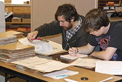 PHOTO BY TORREY HARTMAN - two students go through files at the Humboldt County Department of Environmental Health.
