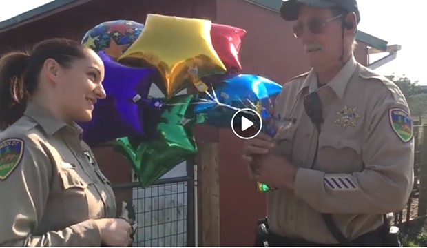 SWAP Farm manager Jeff Dishmon and  Correctional Deputy Samantha Freese in a clip from the video. - HCSO