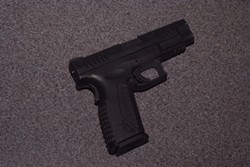 The unregistered .45 caliber handgun a suspect used to shoot a CHP officer with. - EPD