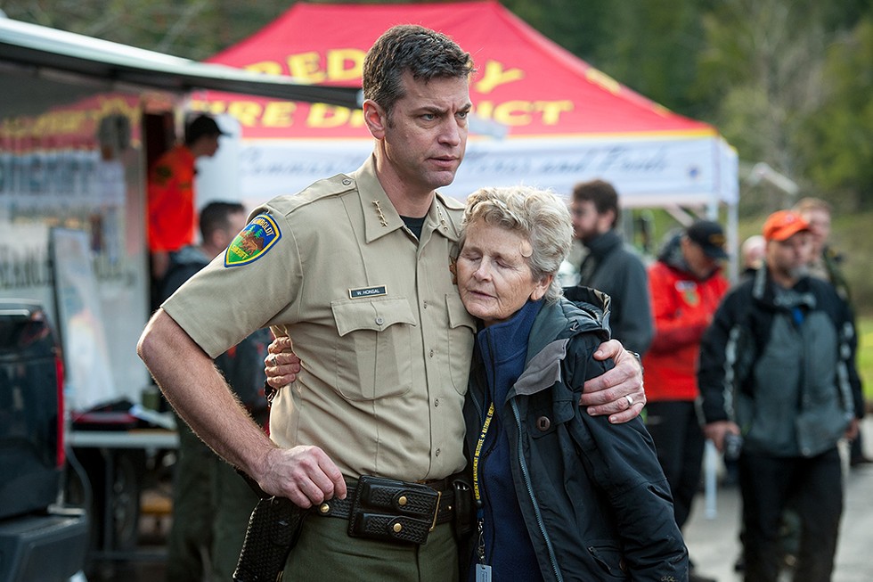 Humboldt County Sheriff William Honsal hugs Supervisor Estelle Fennell shortly before search teams held a debriefing at the command post on Saturday evening. - PHOTO BY MARK MCKENNA