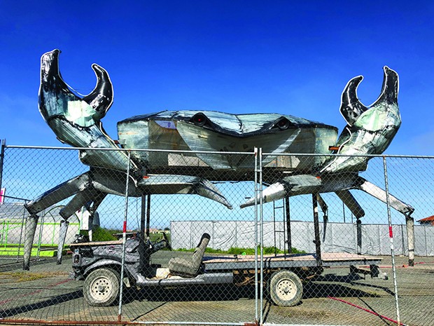 Dan McCauley’s shining metal crab awakens from its post-Burning Man slumber and raises its pincers in the lot of Spaulding Construction off U.S. Highway 101 in Eureka. - PHOTO BY JENNIFER FUMIKO CAHILL