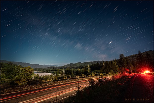 The paths the stars make as the Earth turns beneath them are revealed in this long exposure overlooking the Eel River Valley from Vista Point, Humboldt County, California. - DAVID WILSON