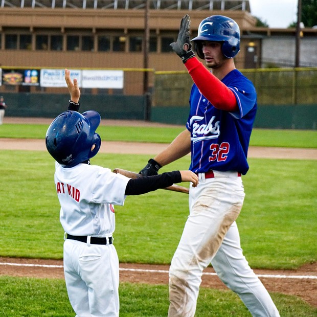New Crab Vinny Bologna celebrates with the Bat Kid after scoring a run in Tuesday's game - MATT FILAR