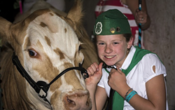 Proud 4-H kid Jocie Hague with her prize cow at the Humboldt County Fair. The Redwood Acres Fair, which also features 4-H and FFA animals, is canceled for 2020. - PHOTO BY MARK LARSON