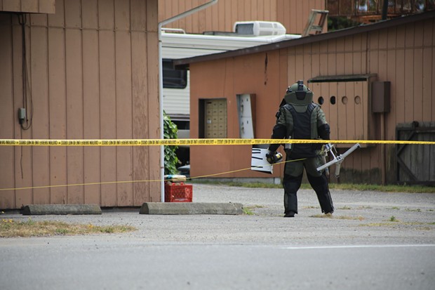 Humboldt County Sheriff's deputy wearing safety gear to examine the package. - HUMBOLDT COUNTY SHERIFF'S OFFICE
