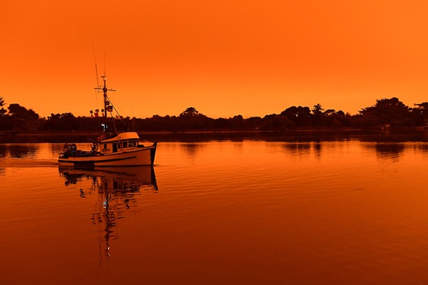 Wildfire smoke turned Humboldt County skies orange throughout the day Wednesday. - MARK MCKENNA