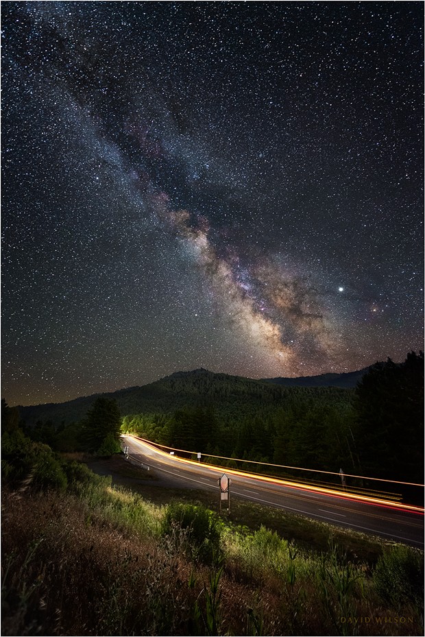 Three months later and six hours earlier than in the country road photograph, the Milky Way will be in the same position that it was over the country road. Though shot last year, this image shows the night sky on July 22 at 10:54 p.m. It is a calendar difference of almost precisely three months, taken six hours earlier in the night, and it shows the Milky Way in the same position in the sky. It’s no coincidence that six hours is one quarter of the day, and three months is one quarter of the year. After a full trip around the clock and a full year later, the sky will be the same again — except for the planets, which move independently from the stars relative to us. Fascinating. - Foreground: U.S. Highway 101, the Redwood Highway, south of Scotia, Humboldt County, California. The highway passes over the Eel River at the far end of this stretch. - PHOTO BY DAVID WILSON