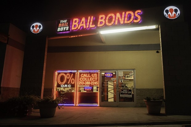 The Bail Boys bail bonds displays a "No on Prop 25" poster in downtown Los Angeles on Oct. 21, 2020. Prop. 25 would end California's current cash bail system and replace it with a three tier risk assessment system. - PHOTO BY TASH KIMMELL FOR CALMATTERS.