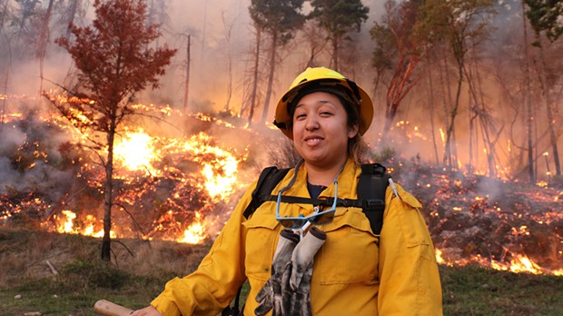 Vikki Preston, a member of the Karuk Tribe, pauses to catch her breath after her crew ignited accumulated woody fuels on a slope near Orleans in a controlled burn two years ago. - SUBMITTED