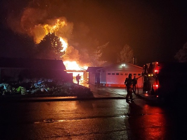 A shop was fully engulfed in flames on Holly Drive Friday night. - PHOTOS BY JOSH NIKOLAUSON