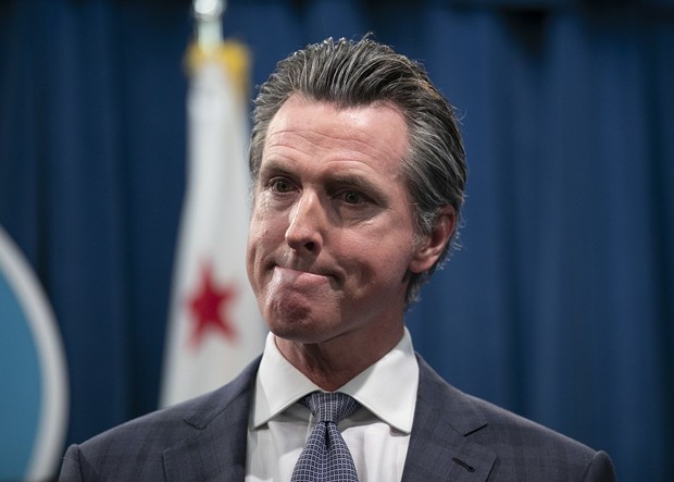 Two new surveys show Gov. Gavin Newsom's approval among Californians plummeting from its highs early in the coronavirus pandemic. He's shown here at a press conference in the state Capitol following the first COVID-19 death in California on March 4, 2020. - PHOTO BY ANNE WERNIKOFF FOR CALMATTERS